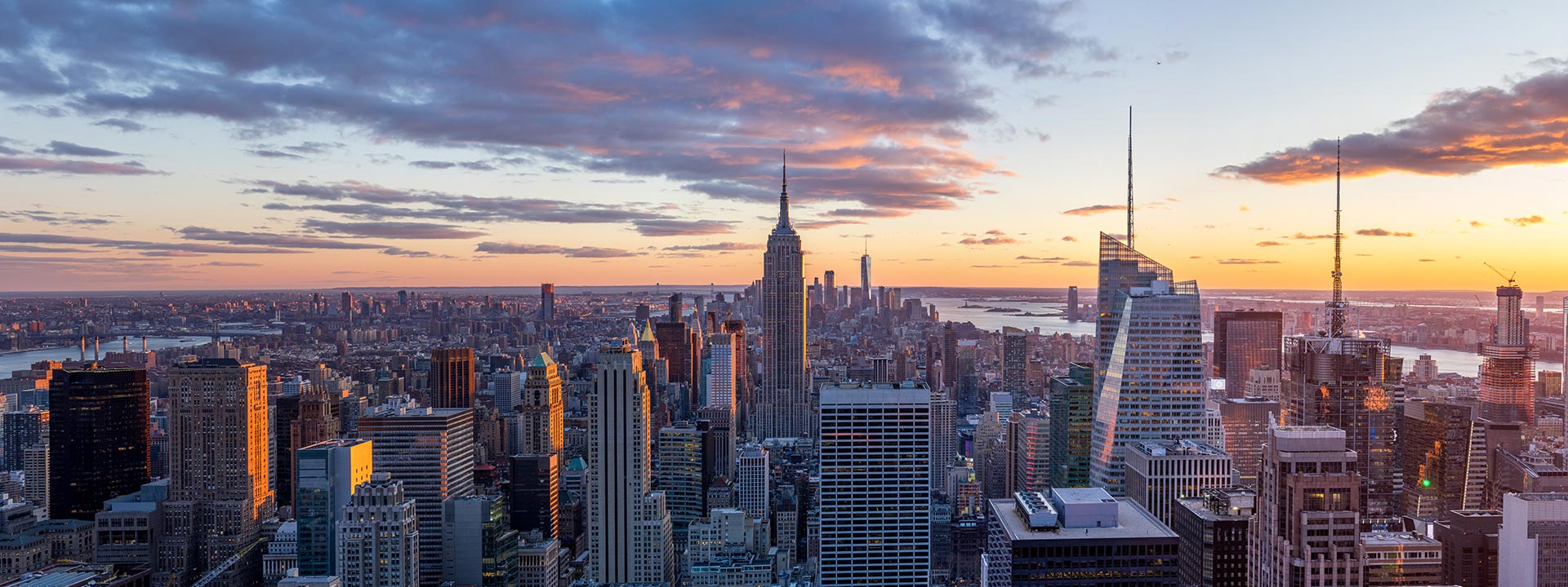 Amazing panorama view of  New York city skyline and skyscraper at sunset. Beautiful night view in Midtown Manhatton