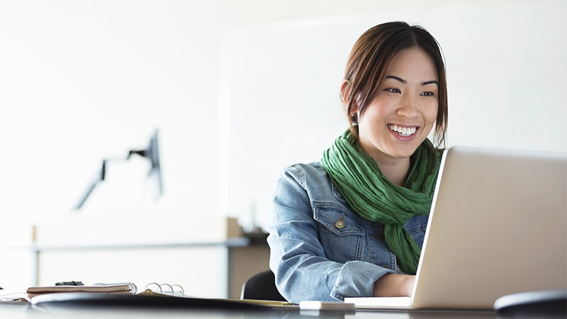 asian lady working with a smile